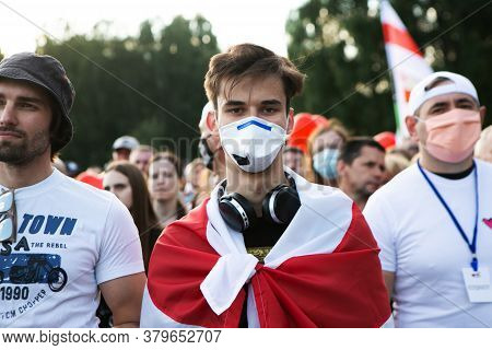 Minsk/belarus - July 30, 2020: Portrait Of Young Man In Face Mask And Flag At Opposition Rally In Mi