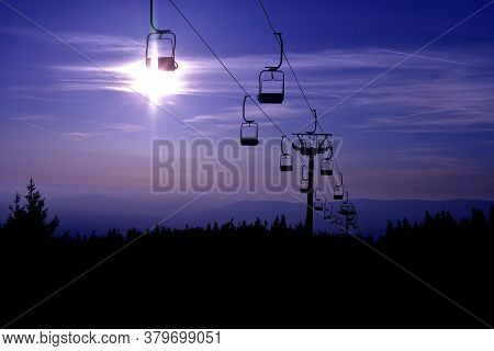 Ski Chair Lift In The Mountains At Blue Night
