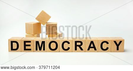 Wooden Blocks With The Word Democracy. Business Concept