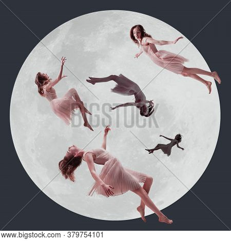 Mid-air Beauty, Moon Light. Full Length Shot Of Attractive Young Woman Hovering In Air And Keeping E