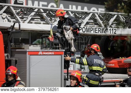 Bucharest, Romania - August 6, 2020: Firefighters Try To Extinguish A Fire That Spread Across An Apa