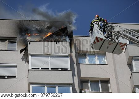 Bucharest, Romania - August 6, 2020: Firefighters Try To Extinguish A Fire That Spread Across An Apa