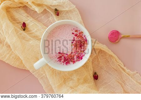 Cup Of Rose Cardamom Ayuverdic Drink On Pink Background.