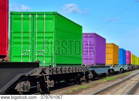 Cargo Containers Transportation On Freight Train By Railway. Intermodal Container On Train Car. Rail