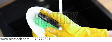 Gloved Hands Wash Dishes Under Pressure Water. Dishwashing Detergents. Qualitatively Wash Dirt From 