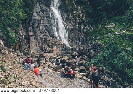 Gwynedd, Wales, Uk - 30 July, 2020: Crowd Of People At Aber Falls Or In Welsh Rhaeadr Fawr . This Wa