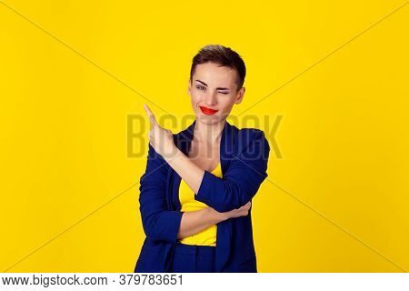 Woman Winking Blinking Eye Pointing Index Finger Indicating To Copy Space Looking To Side Isolated O