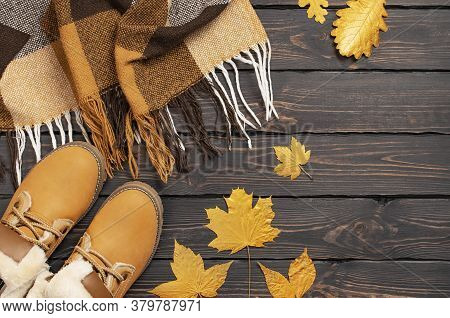 Autumn Fashion Concept. Brown Orange Leather Women Boots With Fur, Checkered Warm Plaid, Golden Autu