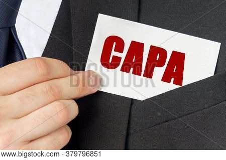 Business Concept. Businessman Holds A Card With The Text - Capa
