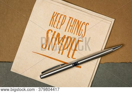 keep things simple inspirational note - handwriting on a a napkin against handmade paper, simplicity,  minimalism or lifestyle concept