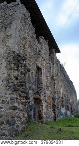 Medieval Castle Ruins In Latvia Rauna. Old Stoune Brick Wall Of Raunas Castle Where Was Living Archb