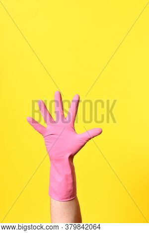 Hand With Glove, Palm, On Yellow Background