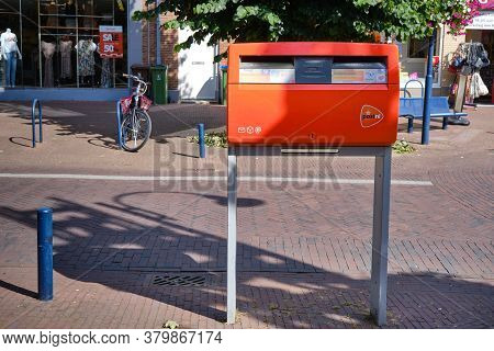 Benekom, The Netherlands-july, 30, 2020:dutch Red Mailbox, Letter Box, By Logistics Company Postnl I