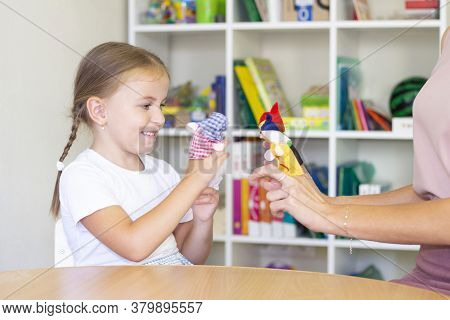 Developmental And Speech Therapy Classes With A Child-girl. Speech Therapy Exercises And Finger Thea