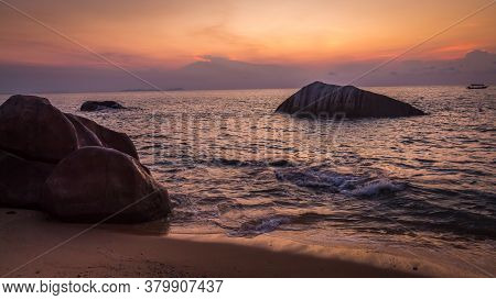 Rocks And Waves On Melina Beach At Sunset, Tiomen Island, Malaysia