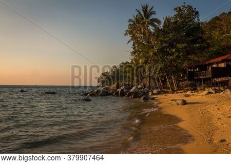 The Sun Shining On Melina Beach At High Tide At Sunset, Tiomen Island, Malaysia