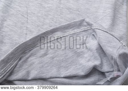 Grey Cotton Fabric Close Up. Hem Tee Shirts, Dress Hem. Fabric Stitching.