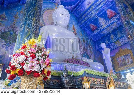 Chiangrai, Thailand - June 7, 2020: White Buddha Sitting In Church And God And Thai Mural At Wat Ron