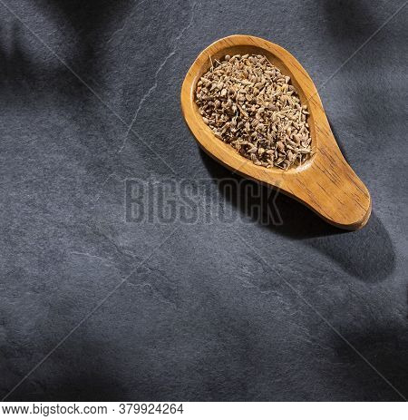 Dried Anise Seeds In Wooden Spoon - Pimpinella Anisum