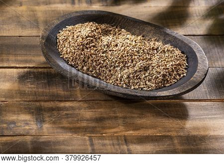 Anise Seeds Seasoning In A Wooden Bowl - Pimpinella Anisum