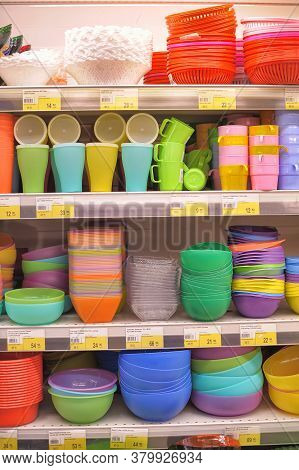 Russia, St. Petersburg, 11,01,2014 Plastic Bowls And Other Plastic Dishes On The Supermarket Shelf