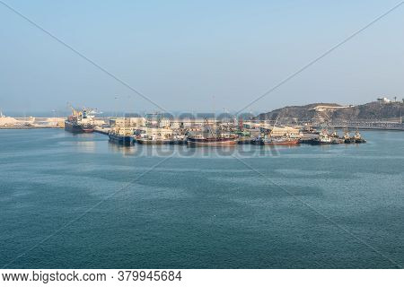 Salalah, Oman - November 19, 2019: Ships Moored In Port Of Salalah In Oman, Arabian Sea. Port Of Sal