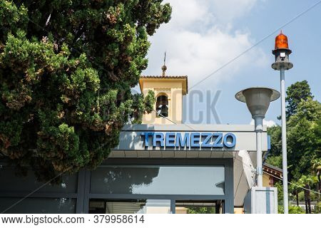Tremezzo. Lake Como. Italy - July 19, 2019: Ferry Pier in the Commune of Tremezzo. Lombardy. Signboard with Name of the City.