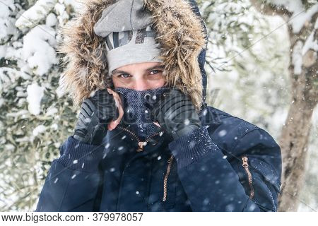 Gazi Antep, Turkey 18 Desember 2019:\na Handsome Man Wears A Warm Scarf Wrapped Around His Neck Whil