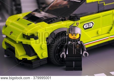 Tambov, Russian Federation - June 24, 2020 Lego Lamborghini Urus St-x Driver Minifigure Near Her Car