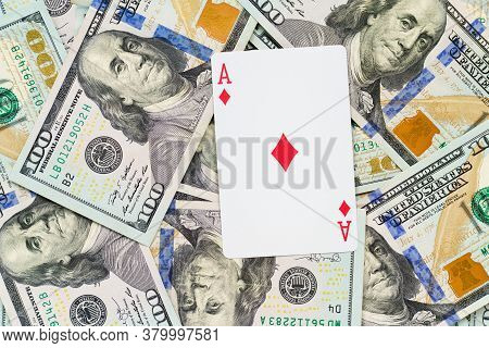 Playing Cards On Us Dollars Background. Close Up Of A Lot Of Banknotes Hundred Dollar Bills. America