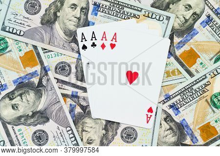 Playing Cards On Us Dollars Background. Close Up Of A Lot Of Banknotes Hundred Dollar Bills. America