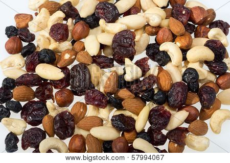 mixed nuts and dried fruits isolated on white background