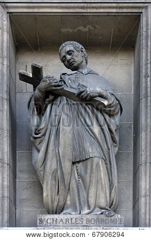 PARIS, FRANCE - NOV 09, 2012: Saint Charles Borromeo, architectural details of Eglise de la Madeleine. Madeleine Church was designed in its present form as a temple to the glory of Napoleon's army.