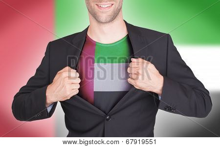 Businessman Opening Suit To Reveal Shirt With Flag