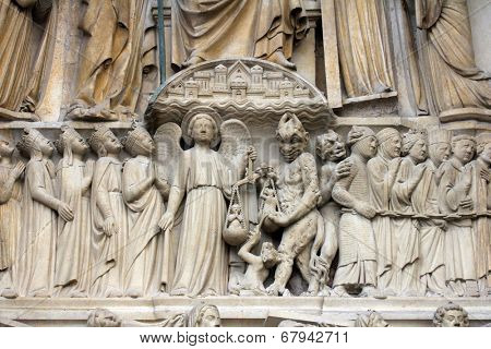 PARIS, FRANCE - NOV 05,2012: architectural detail of Notre Dame cathedral.Detail of central portal, depicting the Last Judgment (c.1230).