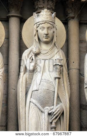 PARIS, FRANCE - NOV 05, 2012: Queen of Sheba, architectural detail of Notre Dame cathedral. Portal of St. Anne was the first of the three west portals to be installed (c.1200).