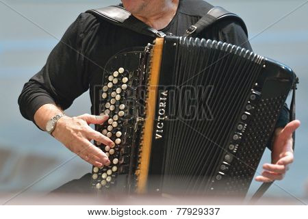 NOVOSIBIRSK, RUSSIA - DECEMBER 8, 2014: French accordionist Richard Galliano on the rehearsal during the festival Classics. The event joins the concert of the World music stars