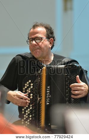 NOVOSIBIRSK, RUSSIA - DECEMBER 8, 2014: French accordionist Richard Galliano on the rehearsal during the festival Classics. The event joins the concert of the World music stars