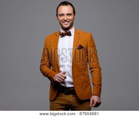 Sharp dressed fashionist wearing jacket and bow tie