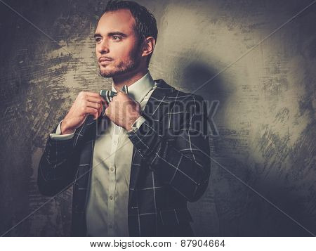 Sharp dressed fashionist wearing jacket and bow tie