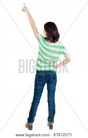 Back view of  pointing woman. beautiful brunette  girl in yellow striped t-shirt. Rear view people collection.  backside view of person.  Isolated over white background.