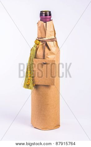 one bottle wrapped in paper with decoration and blank