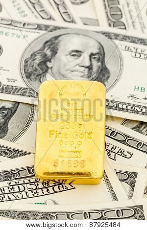 gold bullion on dollar bills, symbolic photo for gold reserves, foreign exchange rates, investment, security