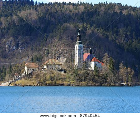Church With A High Bell Tower On The Island On Lake Bled In Slovenia In Europe