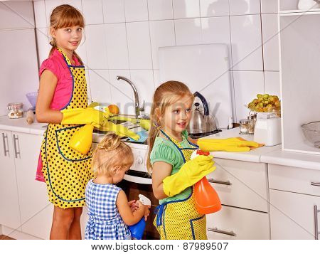 Children little girl cooking at kitchen.