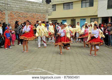 Latacunga, Ecuador 01 October, 2012: Unidentified traditionally clad girls are dancing during La Fiesta de la Mama Negra traditional festival in Latacunga, Ecuador.