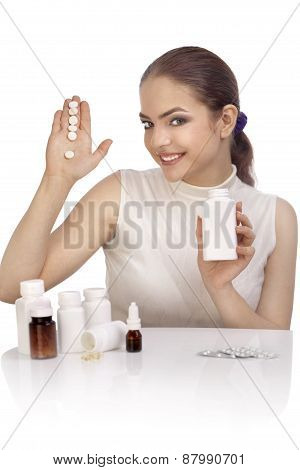 Young Woman Showing Exclamation Mark Made From Pills
