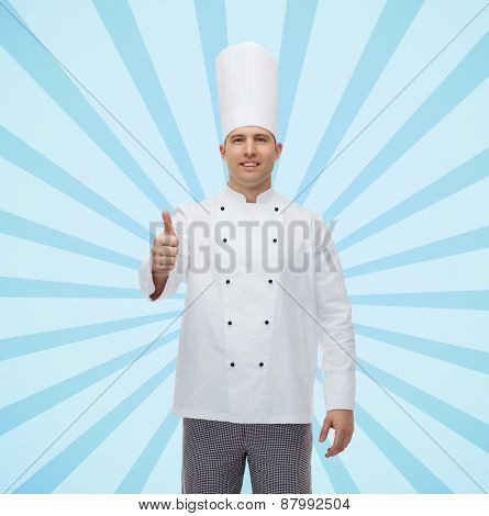 cooking, profession, gesture and people concept - happy male chef cook showing thumbs up over blue burst rays background