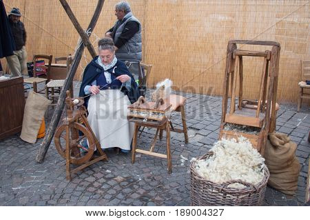 Italy Bologna - November 20 2016: knitter women on their work on market on November 20 2016 in Bologna Emilia Romagna Italy.