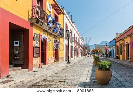 Oaxaca, Mexico - April 17, 2017: Colorful buildings on the cobblestone streets of Oaxaca, Mexico